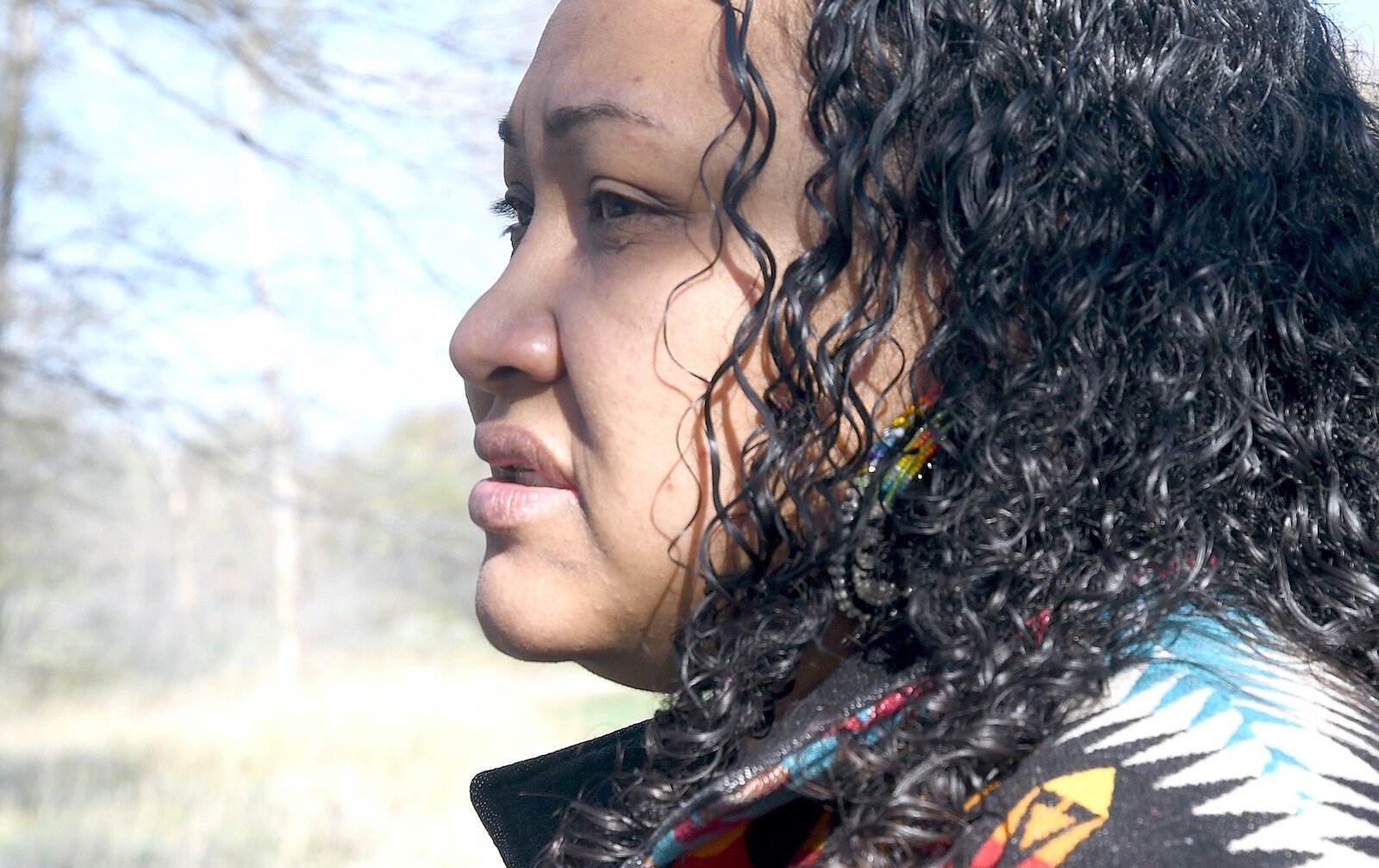 Mariesha Keith stands near Pine Creek at the Nottawaseppi Huron Band of Potawatomi’s Pine Creek Indian Reservation.