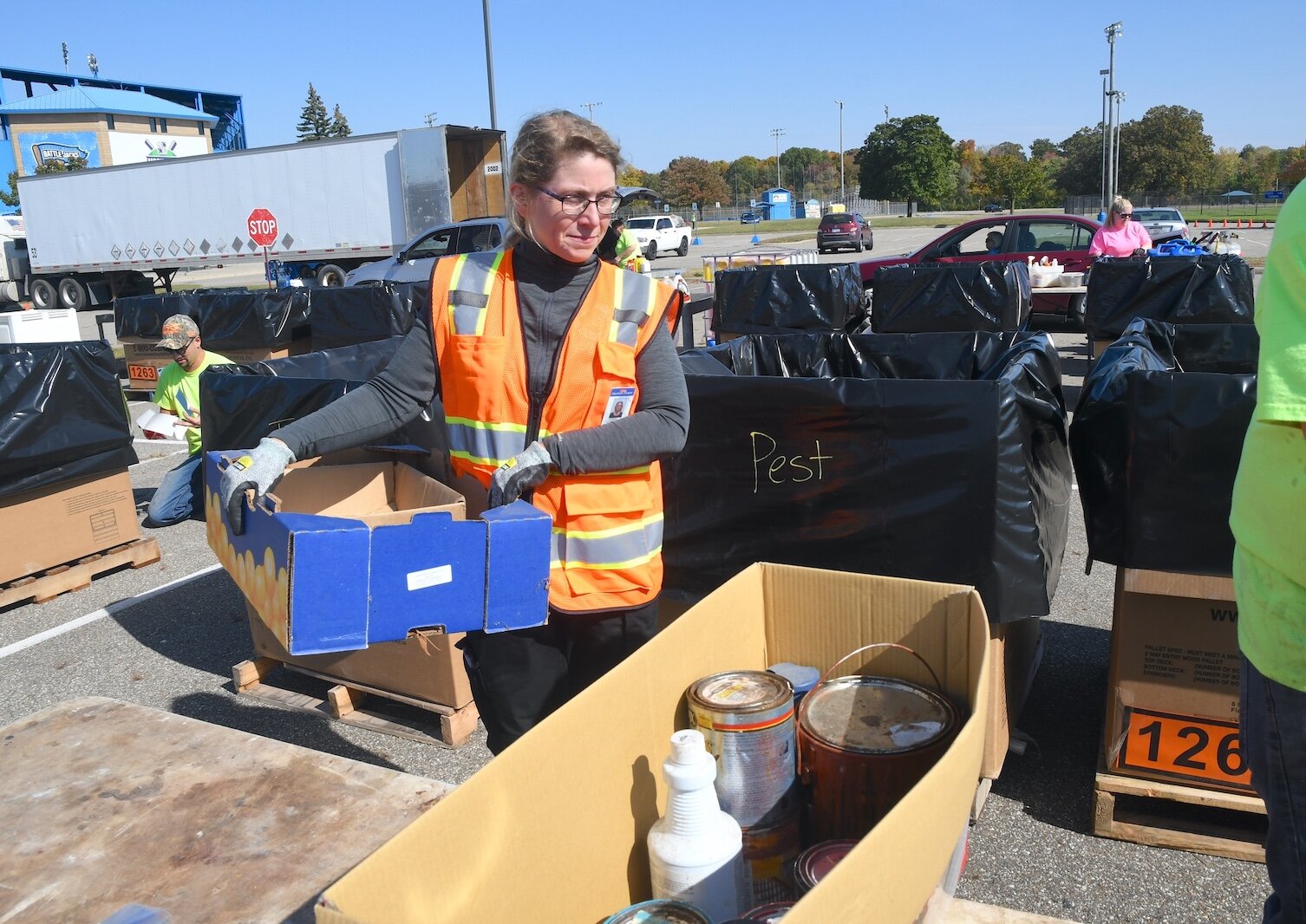 Sarah Lundy, the Calhoun County Recycling Coordinator, oversees a recent public hazardous waste disposal event at Bailey Park in Battle Creek.