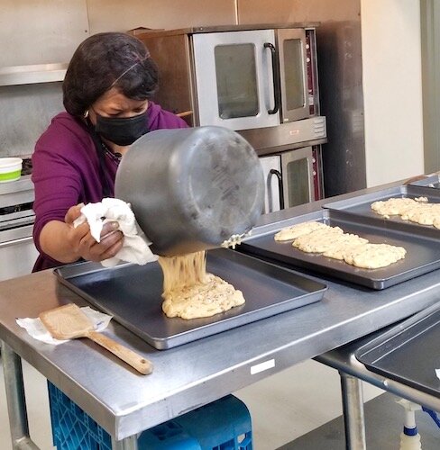 Doreen Gardner is shown making batches of Papa’s Peanut Brittle. She is ramping up production of the sweet treats for the upcoming Catalyst University event.