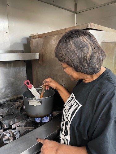 Doreen Gardner tests the temperature of her family-recipe peanut brittle while cooking recently at Kalamazoo's Can-Do Kitchen.