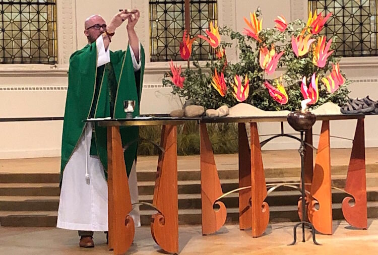 First Congregational Church Pastor Nathaniel Craddock at a recent worship service.