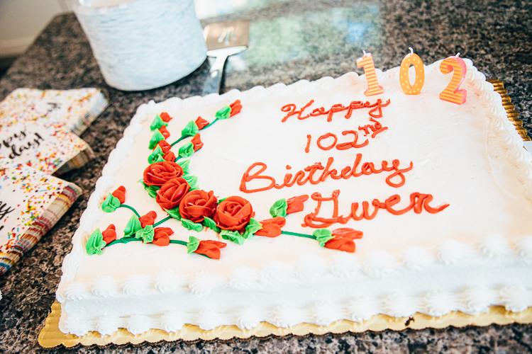 The focus of an On the Ground Feature, Gwen Tulk, a retired librarian and Eastside resident, was celebrated with a song and cake.
