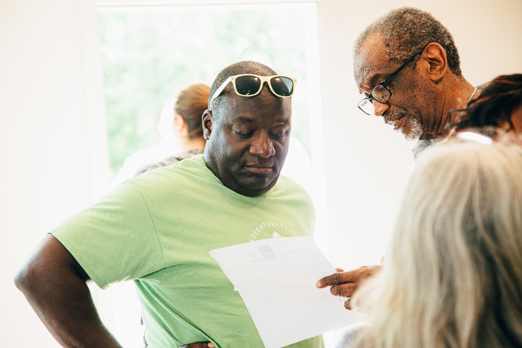 Mayor Bobby Hopewell chats with Eastside resident Buddy Hannah at a recent Eastside celebration.