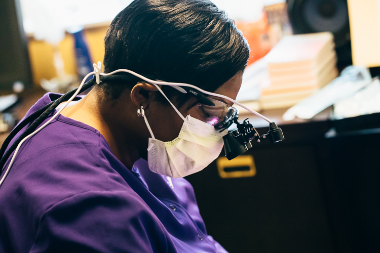 Tiffany Burns, the director and hygienist of Smile Savers, is cleaning teeth at New Village Park Apartments.