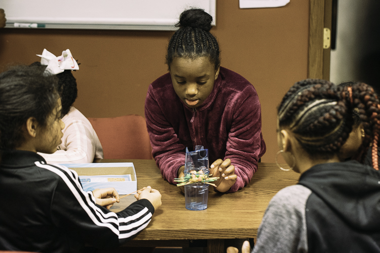 It takes a lot of concentration to avoid dropping marbles, as these girls at CHAMPS know.