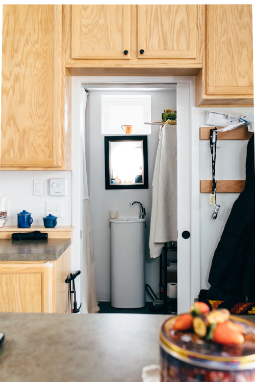 Built like a studio apartment, the tiny house's small bathroom is undergoing the addition of a Japanese soaking tub.