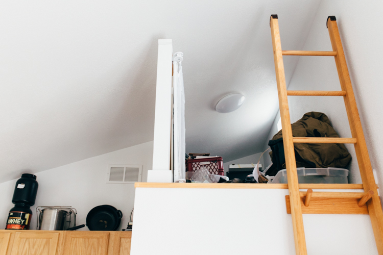 A loft, currently used for storage, can also accommodate a small bed.