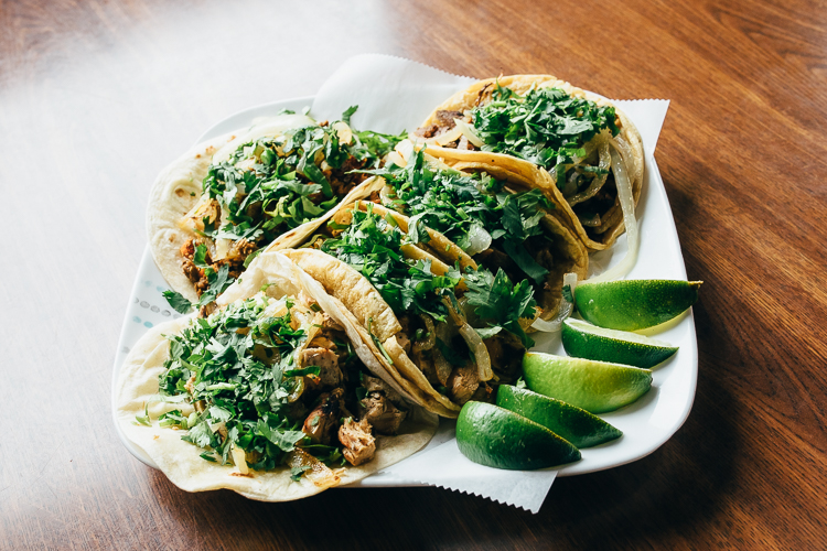 Tacos at Lolita’s are served Mexican-style (with cilantro and grilled onions) or American style (shredded cheese, tomatoes, lettuce, and sour cream).