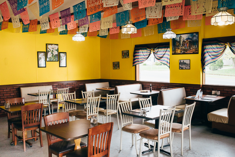 Inside Lolita’s Tacos, the décor features bright colors and paper flags made in Mexico.