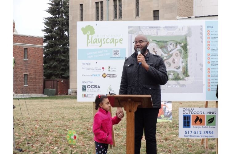 Jeremy Simpson of the First Baptist Church and Kalamazoo Nonprofit Advocacy Coalition addresses those gathered to celebrate the Playscape groundbreaking.