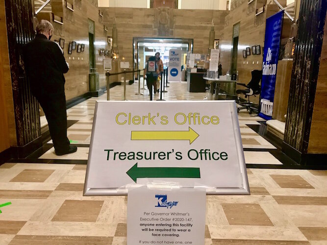 Stanchions are being used to guide people who want to vote early in the Nov. 3 general election at the Kalamazoo City Clerk’s Office. They are shown inside Kalamazoo City Hall in downtown Kalamazoo.