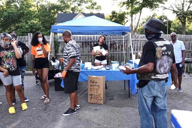 Northside residents are seen at a pop-up event hosted this past summer by STRONG-K, adjacent to the Polar Bear convenience store.