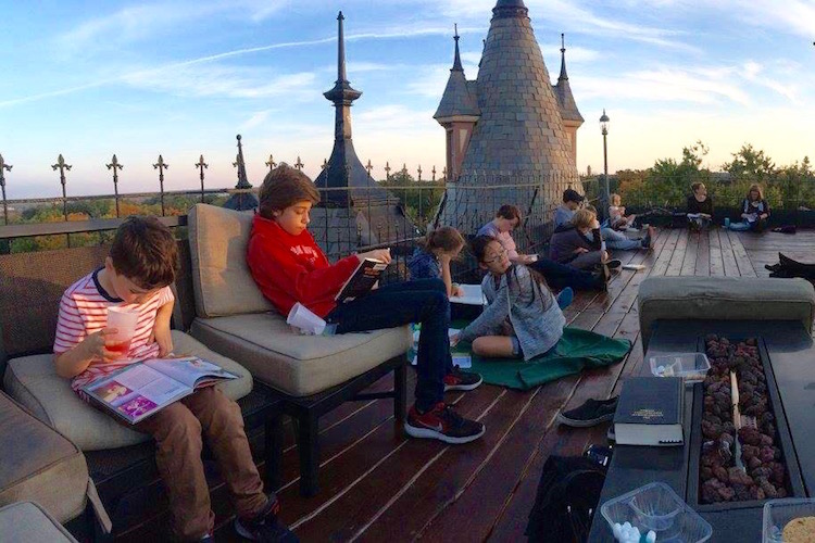 Reading club gathered on the roof of Henderson Castle