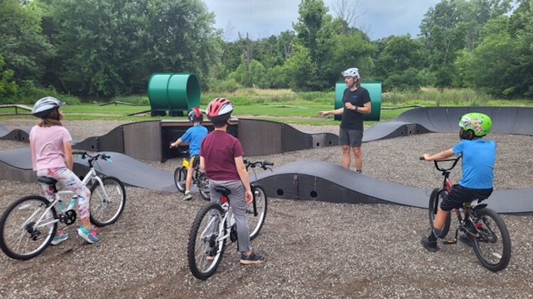 Riding the Pump Track. 