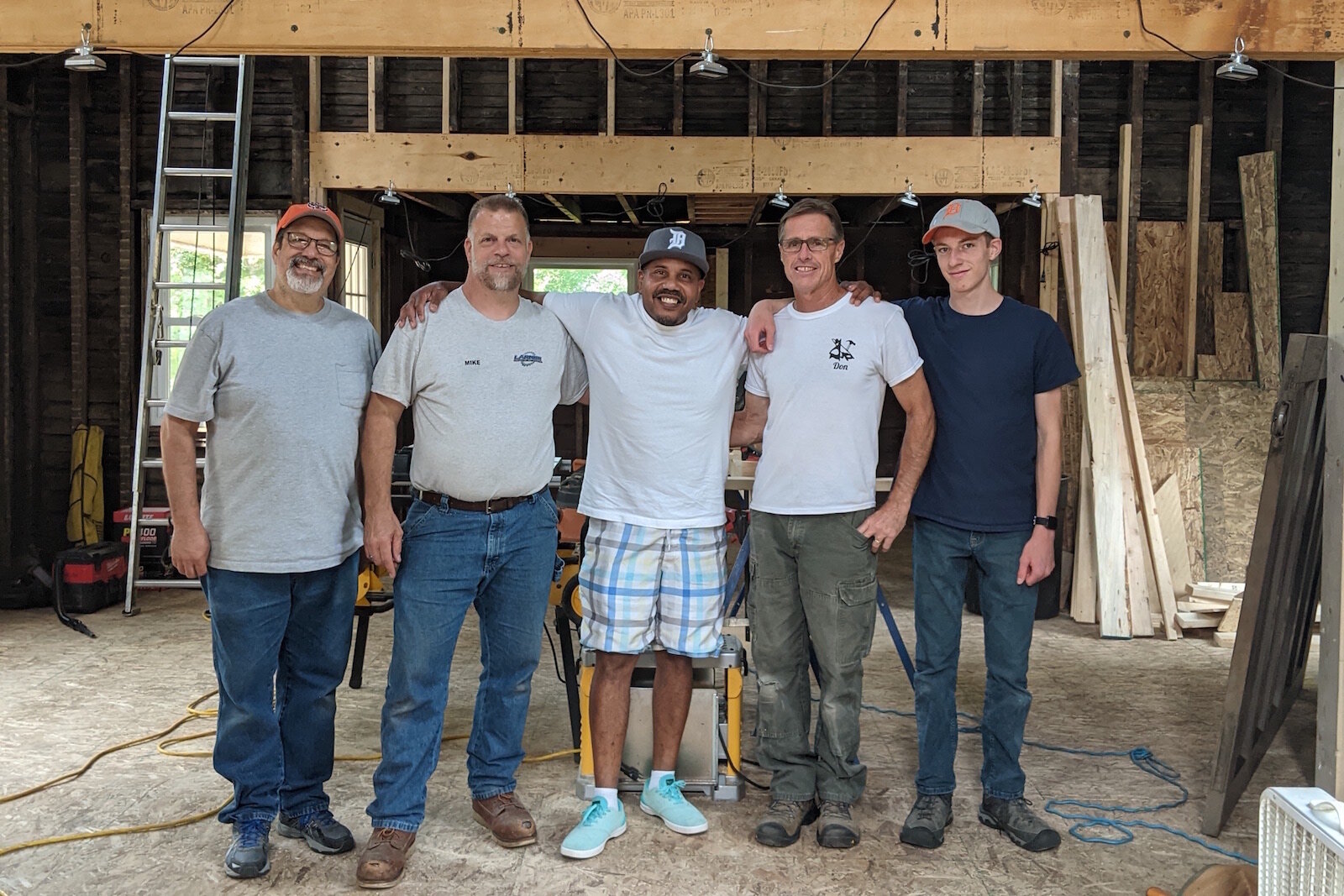 From left, Dan Murphy, Building Dreams; Mike Larner, Larner Construction; Raul Maysonet - Hood Church; Don Rude, Don Rude Building and Remodeling; and Brandon Larner with Larner Construction, take a break from their work.