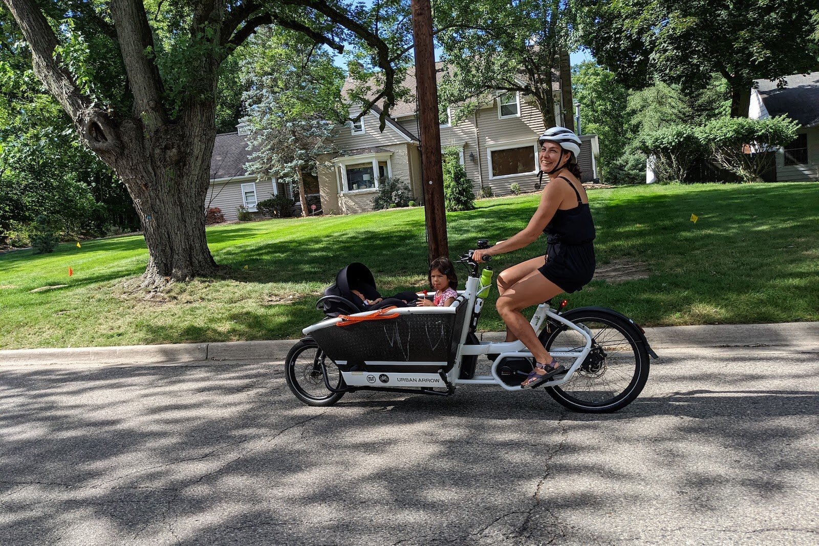 Alexandra Filonyuk and children on a neighborhood ride.