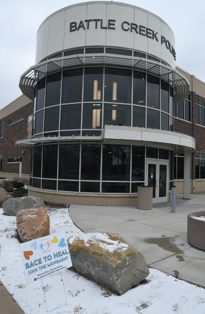 Racial healing sign in front of the Battle Creek Police Department in downtown Battle Creek.