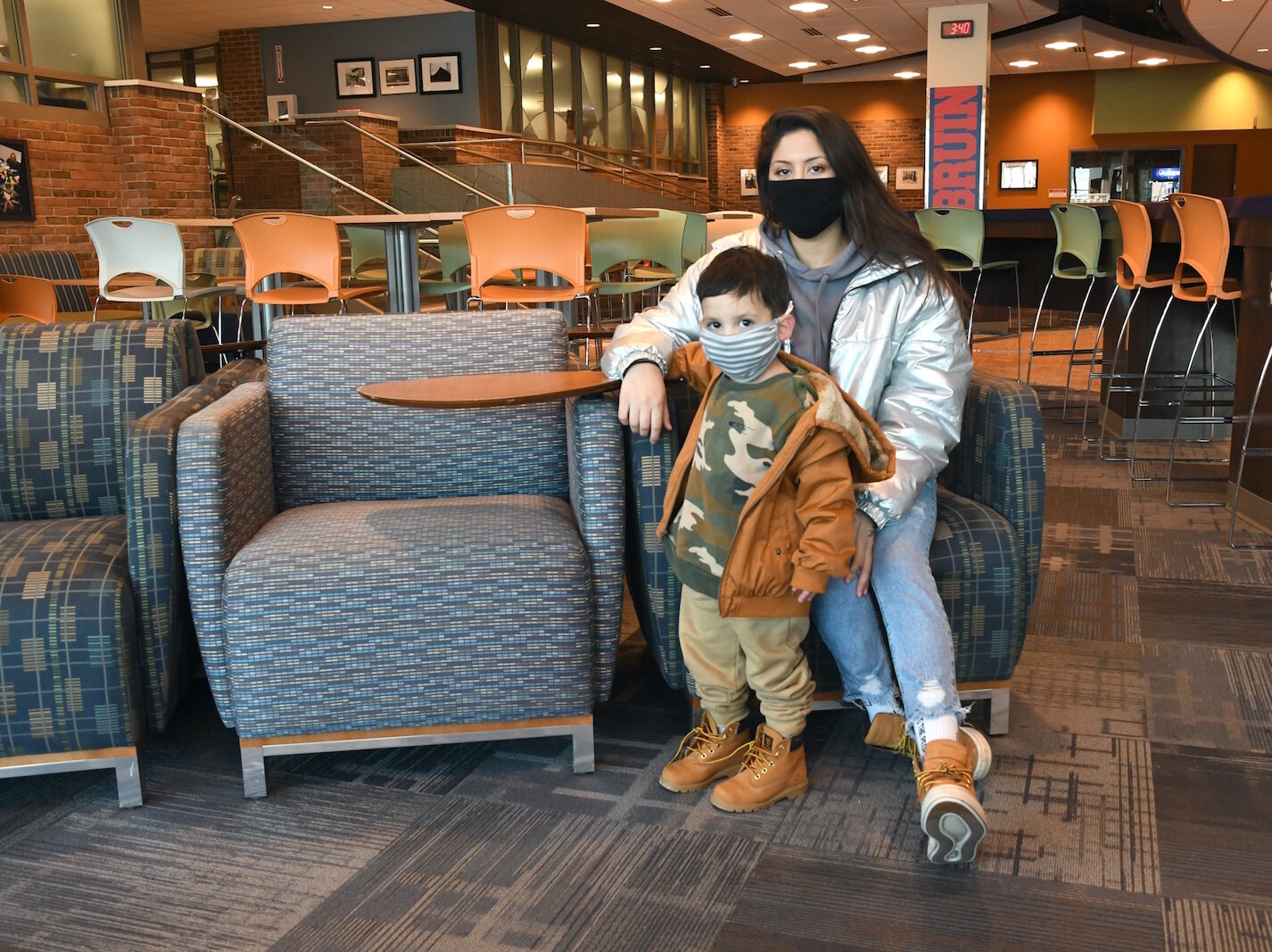 Victoria Fox is seen with her son Sol in the Kellogg Community College student center.