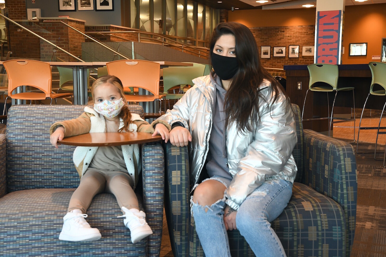 Victoria Fox is seen with her daugher Luna in the Kellogg Community College student center.