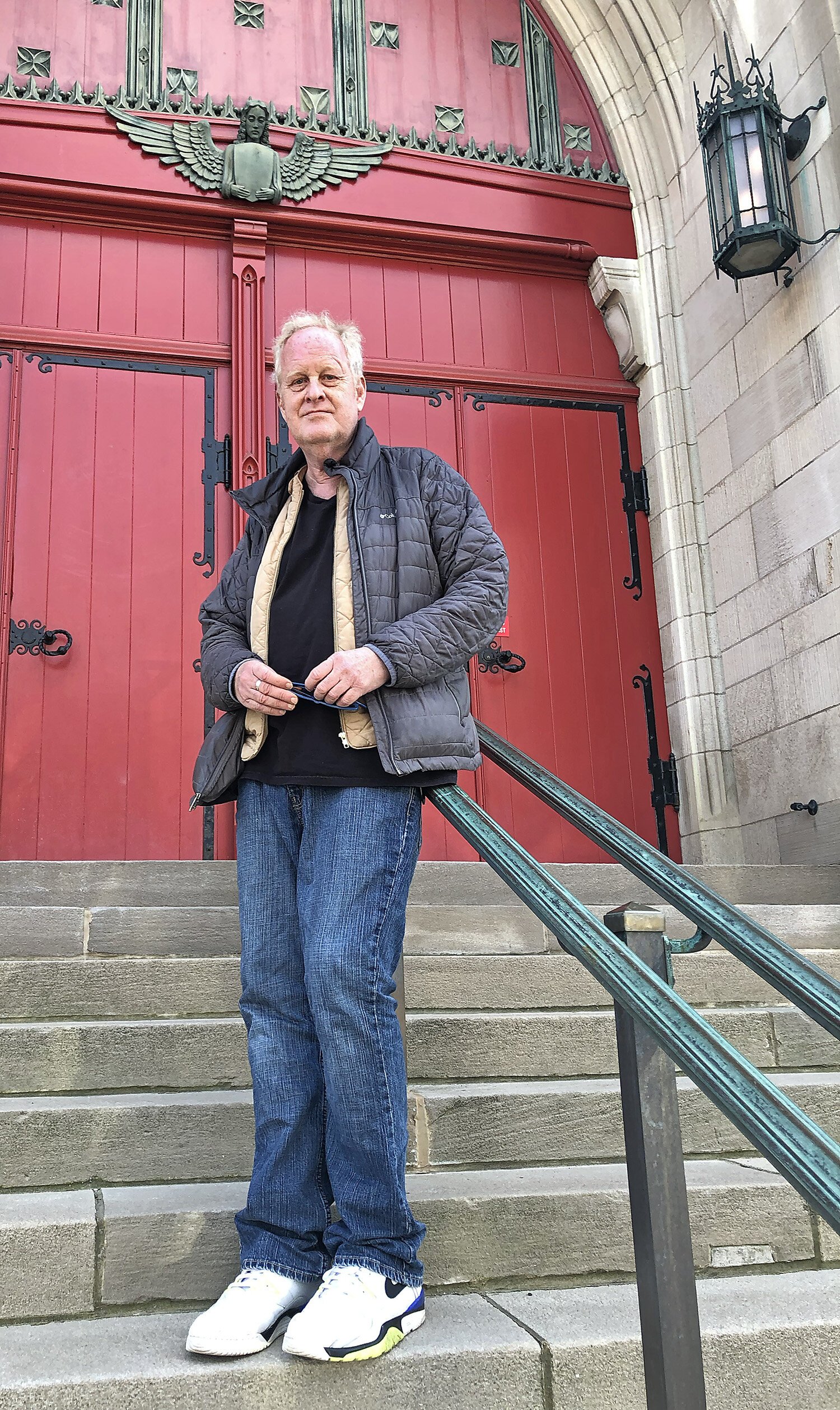 Mat Roe poses by the church’s main door.