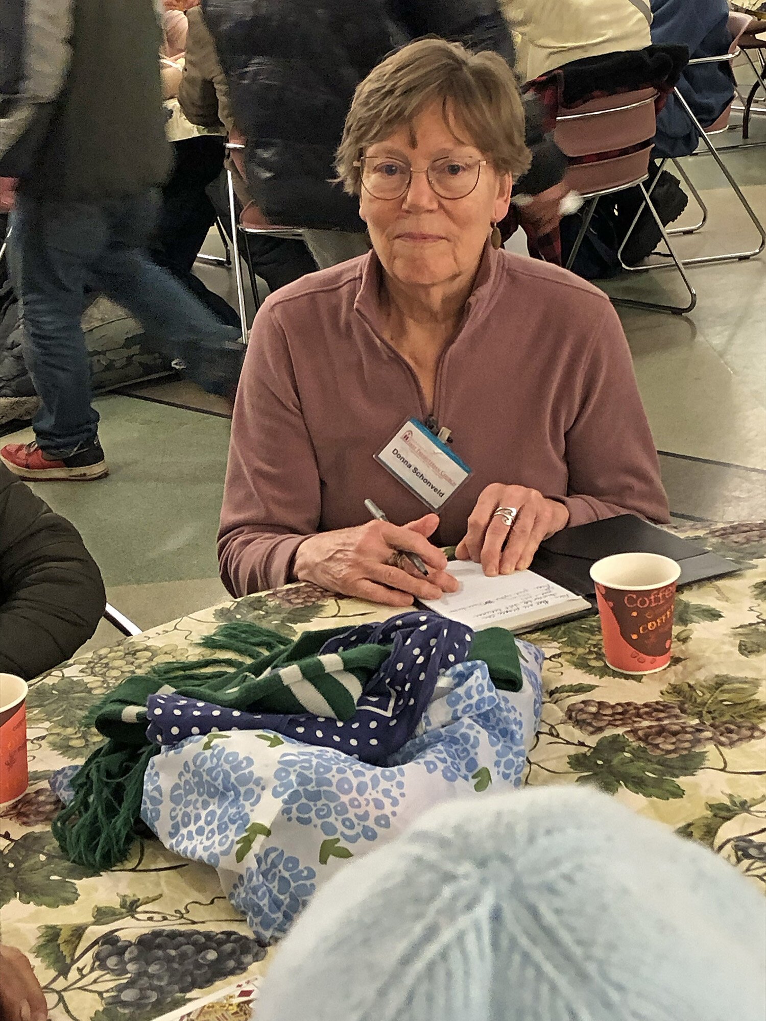 Donna Schonveld listens to requests for prayers.