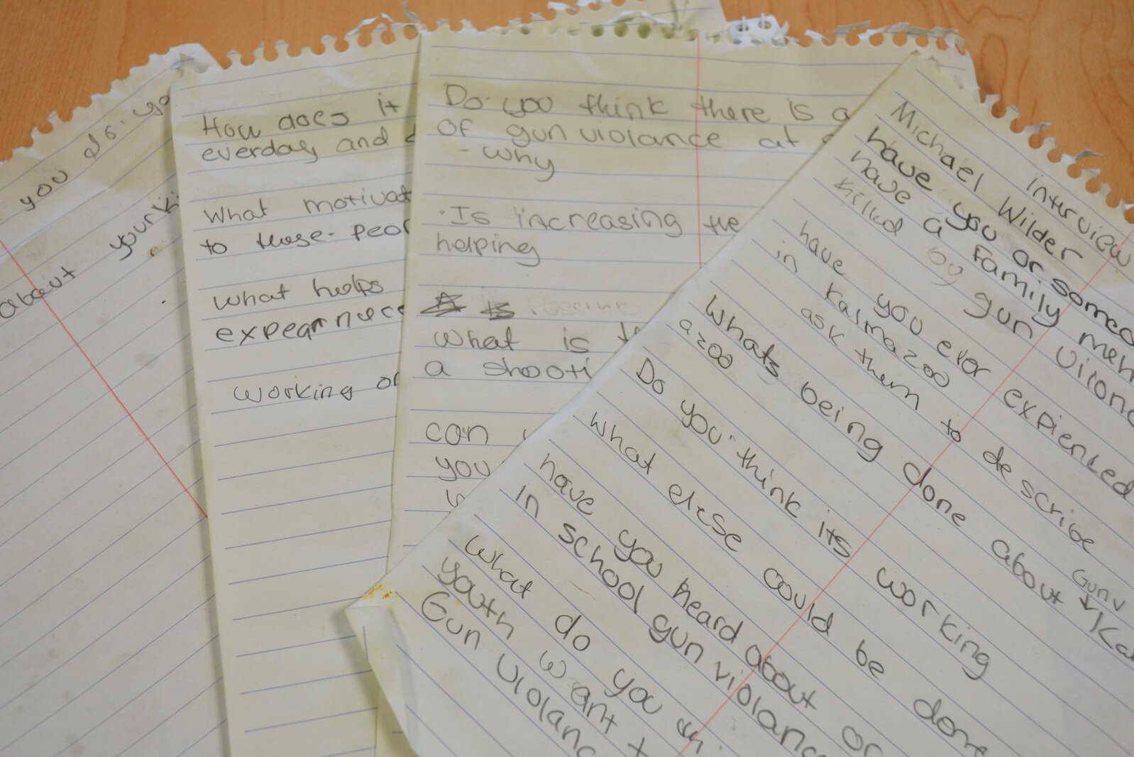 For this story, Regina Kibezi interviewed Michael Wilder about his work counteracting gun violence. Her notes are seen at the table where the interview took place. 