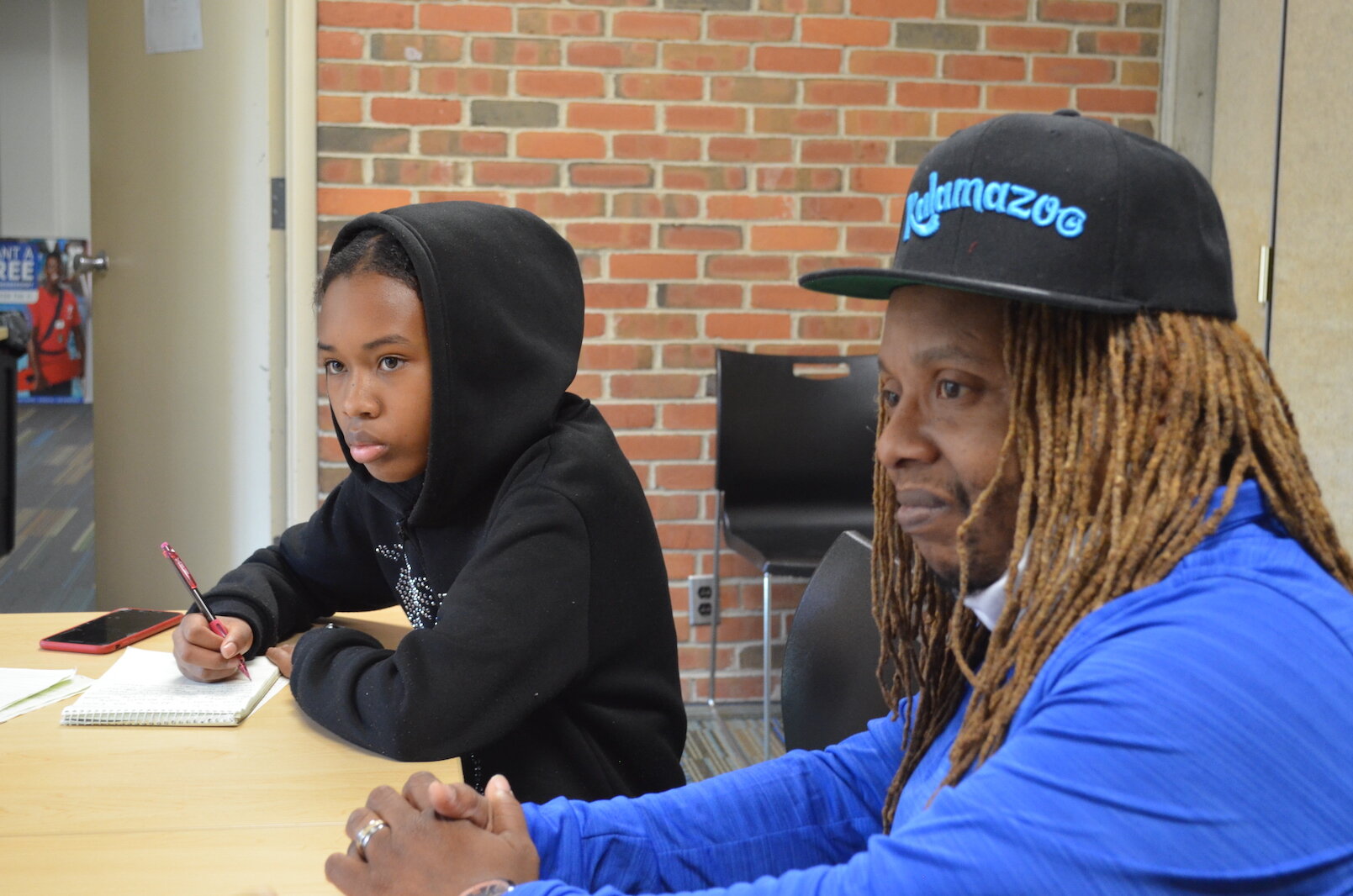 Voices of Youth correspondent Regina Kibezi and Michael Wilder, coordinator of the city of Kalamazoo’s Group Violence Intervention Program, which aims to stop gun violence. 