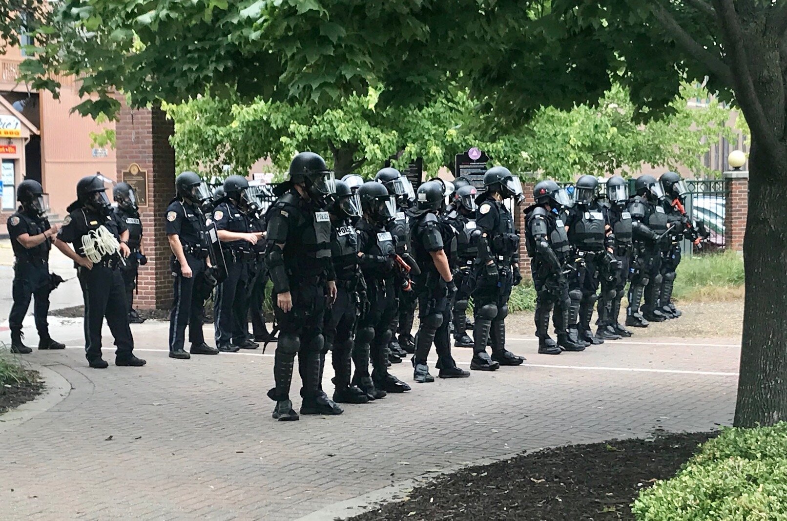 The response of Kalamazoo police to civil unrest during the summer of 2020 is the focus of a new 111-page report. Kalamazoo officers are shown preparing to clear the Arcadia Greek Festival Site on Aug. 15, 2020.