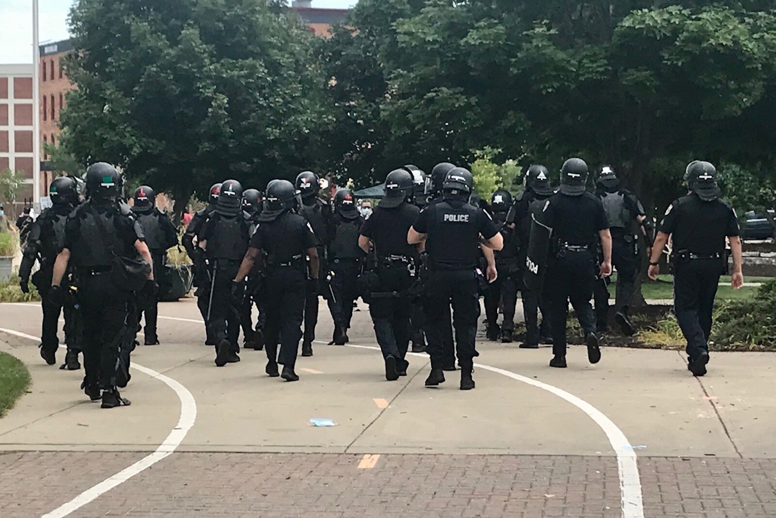 The response of Kalamazoo police to civil unrest during the summer of 2020 is the focus of a new 111-page report. Kalamazoo officers are shown preparing to clear the Arcadia Greek Festival Site on Aug. 15, 2020.