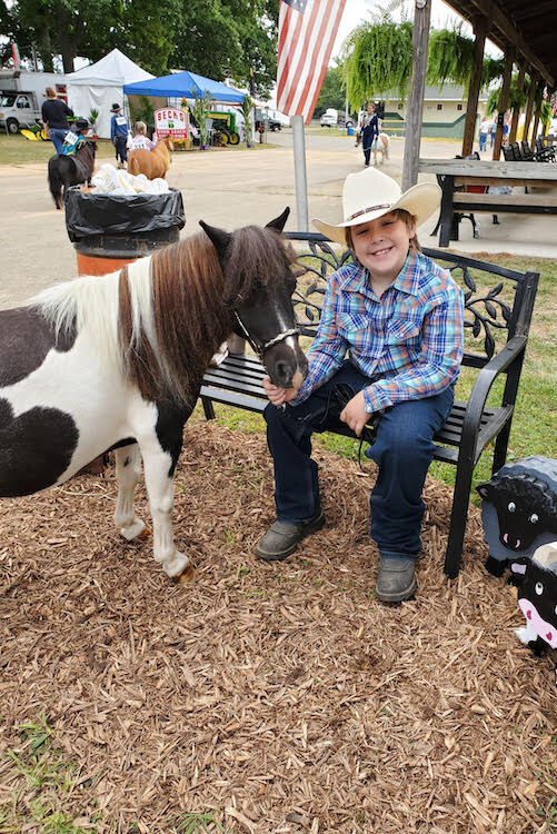  Ryder Strunk poses next to his miniature horse, Pudgy, which he showed in last year’s Calhoun County Fair.  He was working with Pudgy this year and hoped to show him again at this year’s fair which was cancelled.