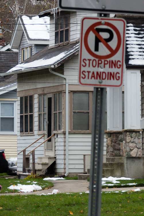 Residents say Public Safety Officers take the No Standing signs to mean people cannot stand together on the street.