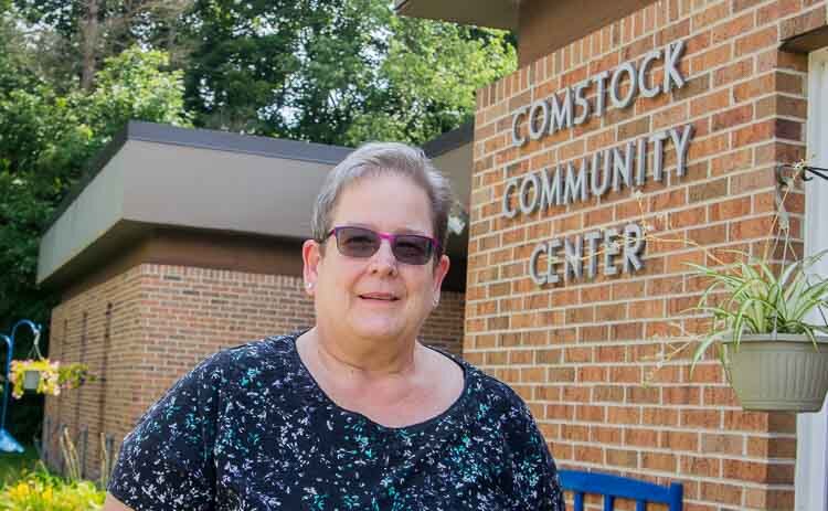 Mary Gustas, executive director of the Comstock Community Center, notes that those priced out of housing in Comstock Township are living in the woods.