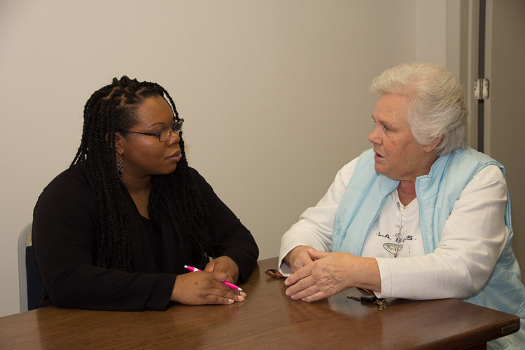 Alisa Parker, managing attorney at Legal Services of South Central Michigan, left, and client Phyllis Robinson