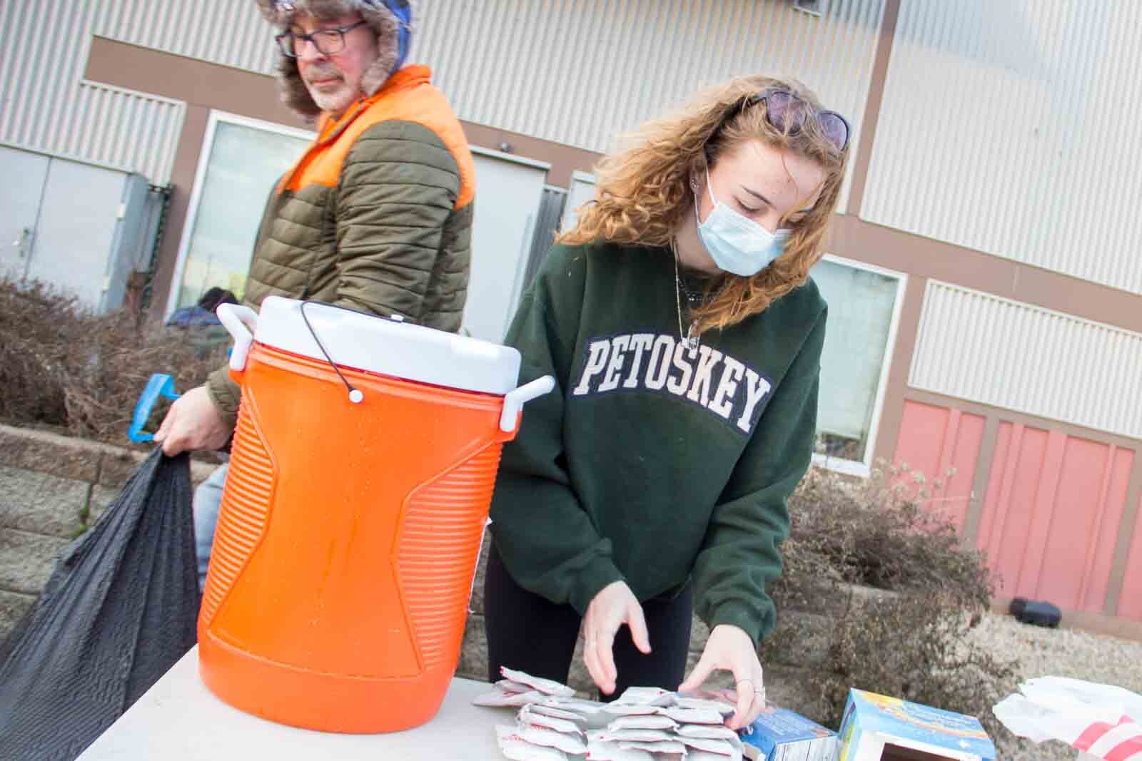 Ella, 17, a senior at Portage Central High School, and her mother have been driving around Kalamazoo at least once a week to distribute food and supplies to people living on the streets. 