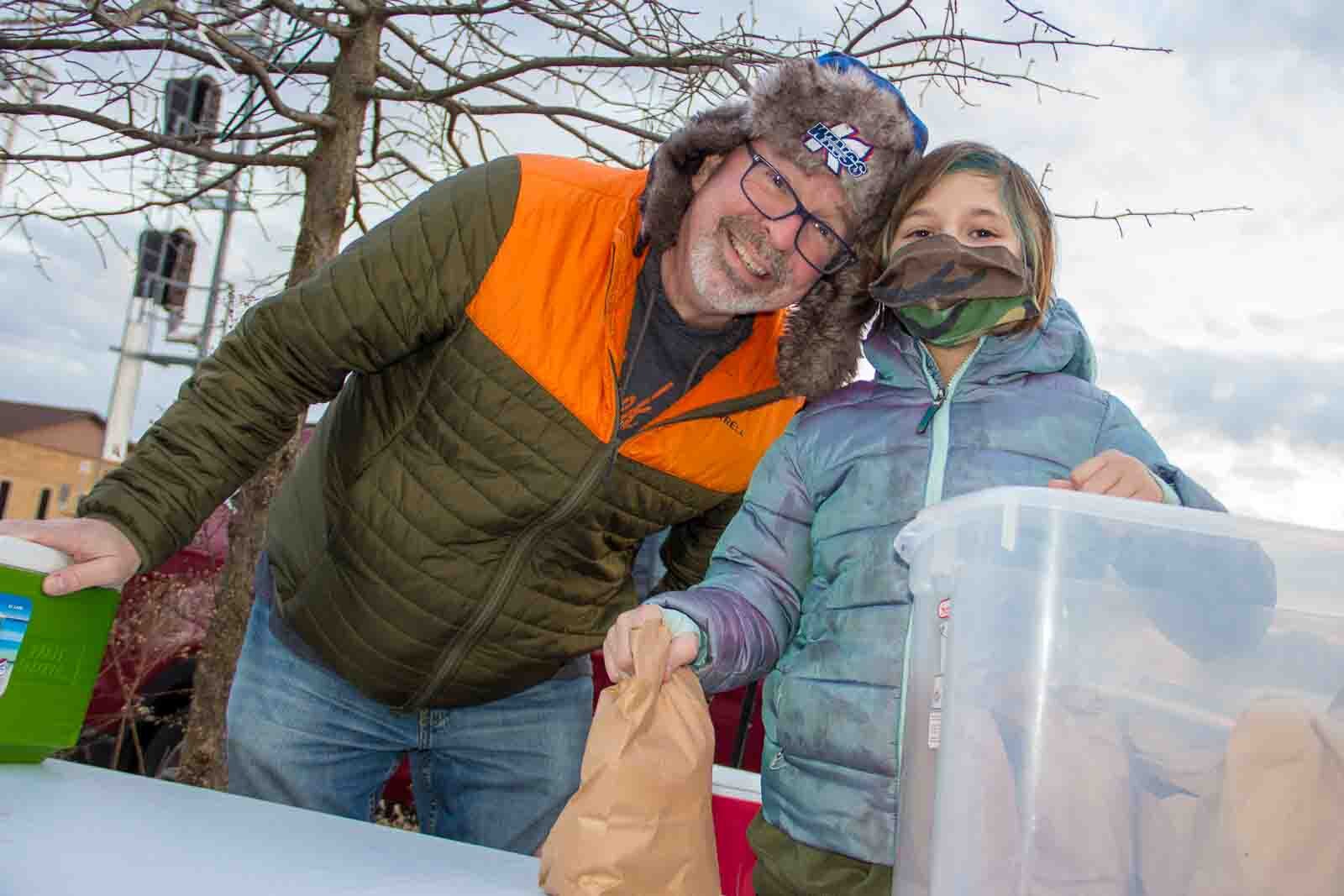 The Johnsons have been joining meal train efforts since December 2020 that have been happening weekly and sometimes more than once a week. Bill Johnson and Delaney Johnson are seen here. 