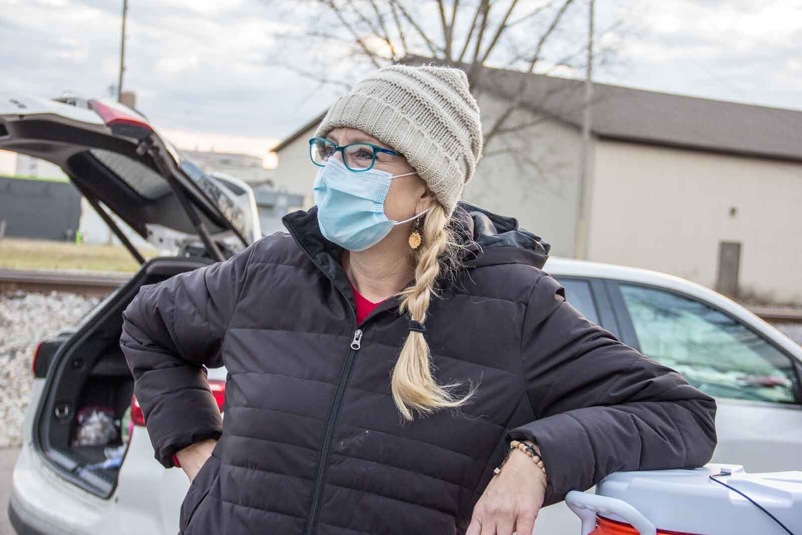 Lisa Johnson and her daughter Ella have been driving around Kalamazoo at least once a week to distribute food and supplies to people living on the streets. 