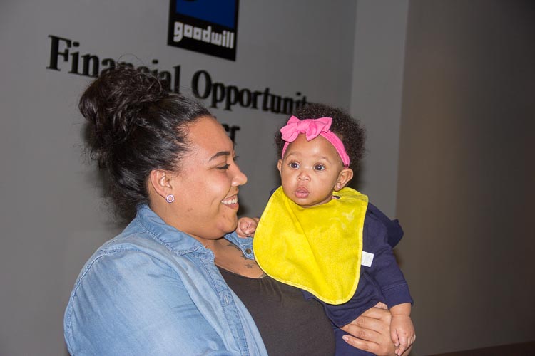 Stephenie Potter gained skills that helped her navigate the workworld as she raises four children, including baby Reighlyn. Photo by Susan Andress