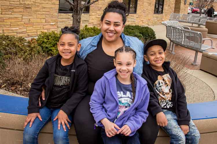 Stephennie with three of her children, RahMya, Kamariona, and Robert. Photo by Susan Andress