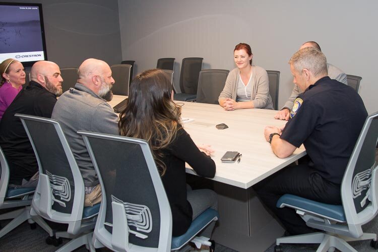 A group meets with Lt. Matthew Robinson, right.