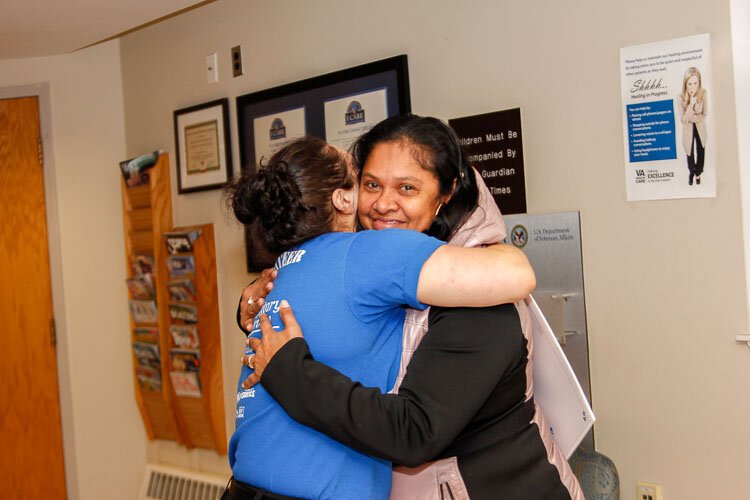 There were lots of human hugs and doggy kisses when volunteers in the Hug Ambassadors program recently offered hugs to veterans at the VA in Battle Creek.