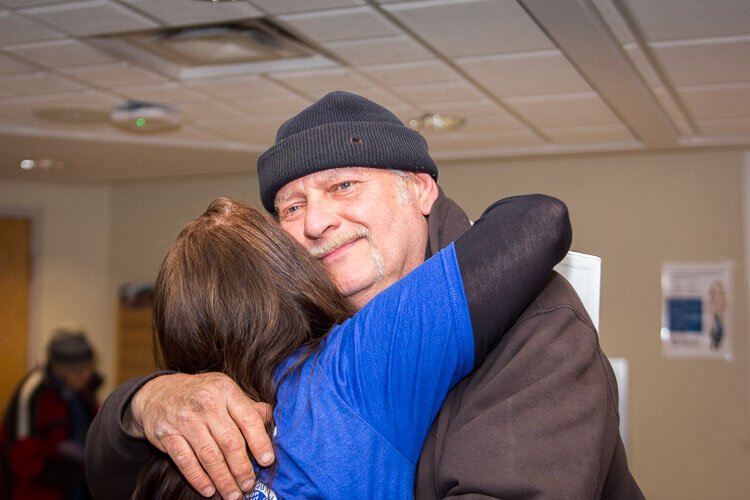 There were lots of human hugs and doggy kisses when volunteers in the Hug Ambassadors program recently offered hugs to veterans at the VA in Battle Creek.