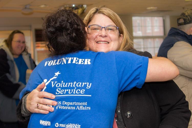 There were lots of human hugs and doggy kisses when volunteers in the Hug Ambassadors program recently offered hugs to veterans at the VA in Battle Creek.