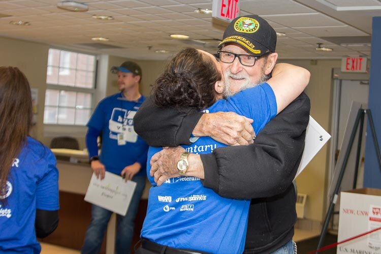 There were lots of human hugs and doggy kisses when volunteers in the Hug Ambassadors program recently offered hugs to veterans at the VA in Battle Creek.