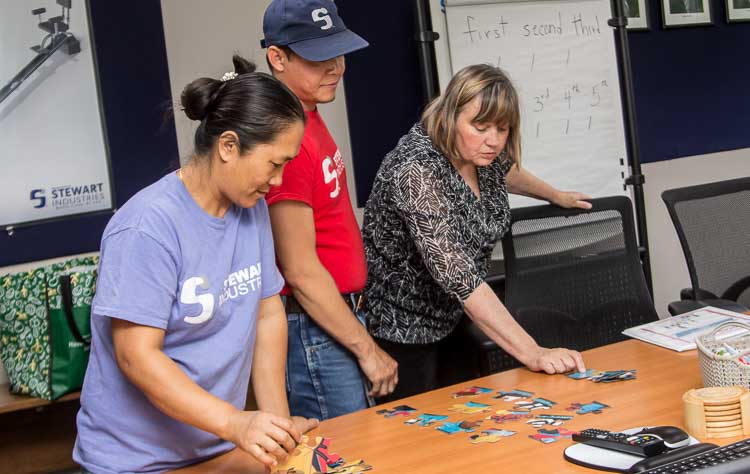 English as a Second Language students Tin Nawn and John Aung learn about edges from puzzle pieces.