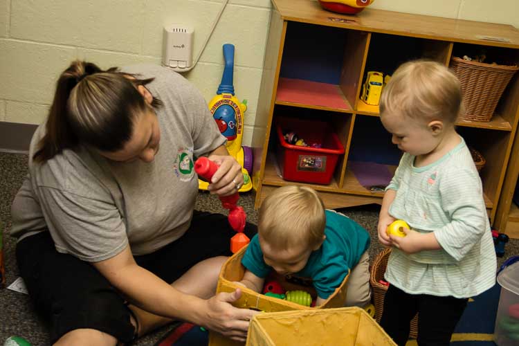 Miss Rosalee Osten helps litle ones learn.