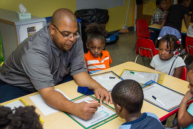 Steven D. Bliss, Assistant Preschool Teacher, assists the preschool students at New Genesis.