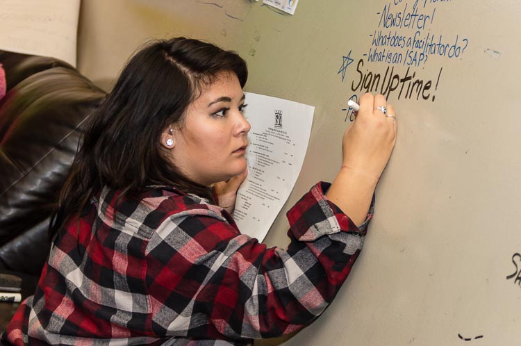 Rachel Cochran, Youth Peer Support Specialist, keeps track of young people's questions.