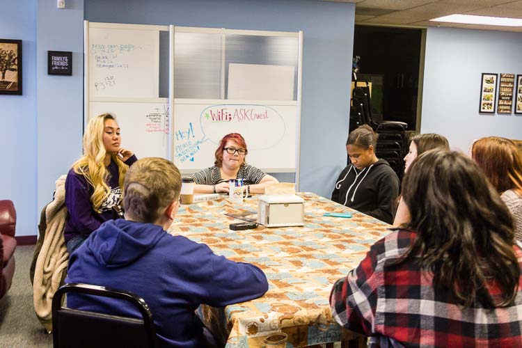 From right, clockwise, Rachel Cochran, Tyler Lynch (in blue), Michelle Kudzia, Denika Dunning, Kori Sonnevil, Grace Barrett develop their questions to ask legislators.