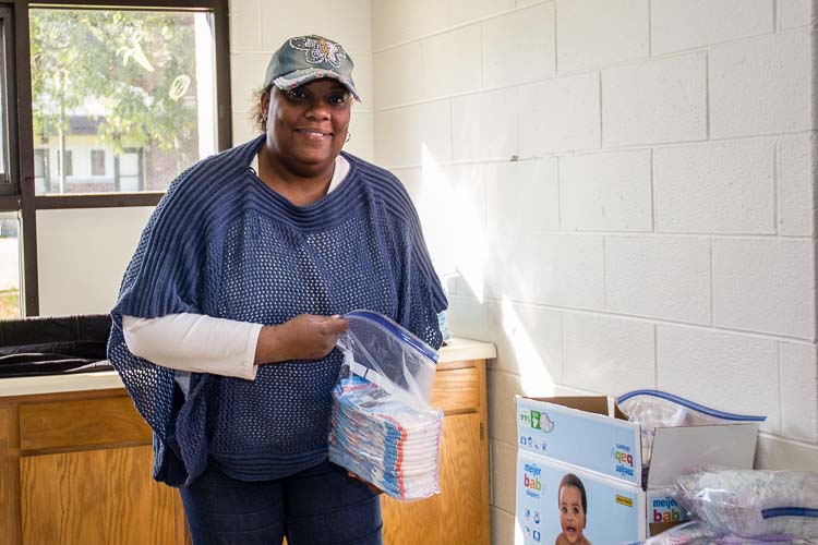 Denise Rucker, a program coordinator, started out as a volunteer with the diaper distribuiton program and her job expanded as the program grew.