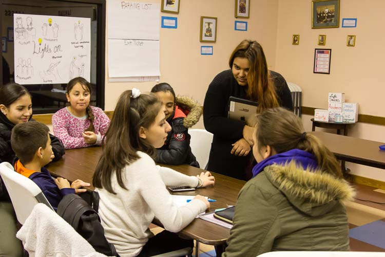 Heather Flores works with youngsters in a VOCES classroom.